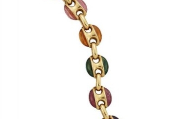 A multi-gem bracelet, each figure-of-eight design link...