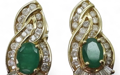 A pair of 14k gold emerald and diamond earrings set with est...