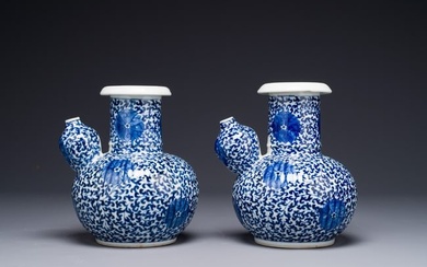 A pair of Chinese blue and white 'lotus scroll' kendis, 19th C.