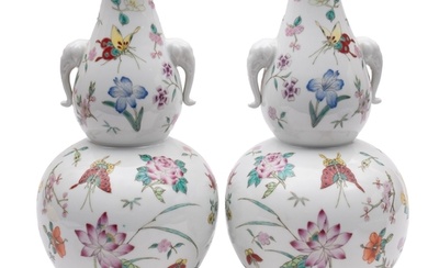 A pair of Chinese porcelain double gourd vases, with elephan...