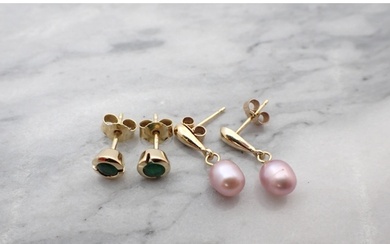 A pair of Emerald Ear Studs each channel-set round stone in ...
