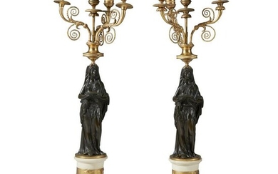 A pair of Empire gilt and patinated bronze and white