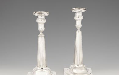 A pair of Mannheim silver candlesticks