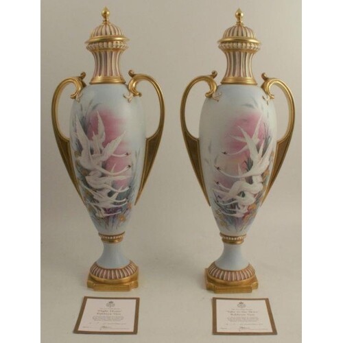 A pair of Royal Worcester limited edition covered pedestal v...