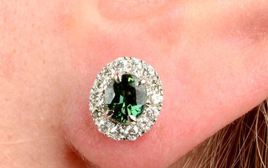 A pair of green sapphire and brilliant-cut diamond earrings.