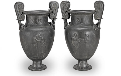 A pair of large patinated bronze urns