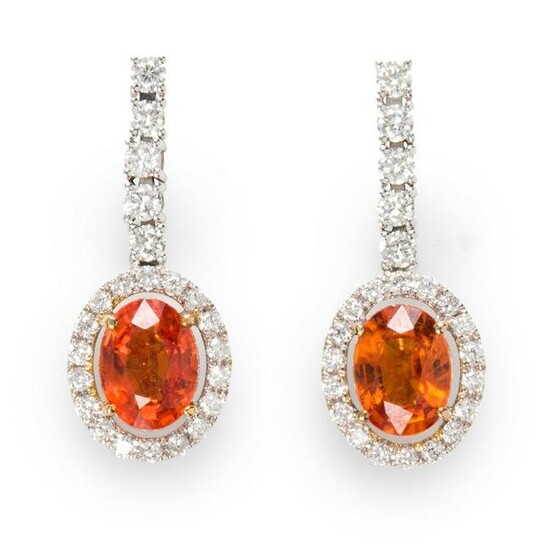 A pair of orange sapphire, diamond and fourteen karat