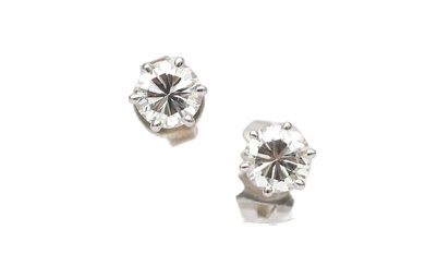 A pair of white gold diamond solitaire ear studs