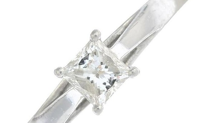 A platinum square-cut diamond single-stone ring.