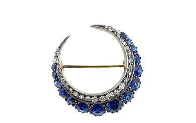 A sapphire and diamond closed crescent brooch