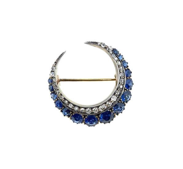A sapphire and diamond closed crescent brooch