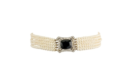 A seed pearl choker with a sapphire and diamond clasp