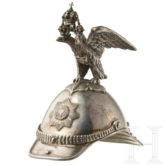 A silver vodka cup in the shape of a Russian guard