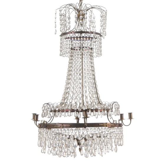 A six-light Empire style crystal chandelier with brass frame. Electrical. Last half of the 20th century. H. 105 cm. Diam. 70 cm.