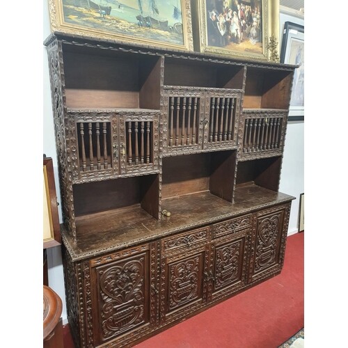 A superb 20th Century highly carved Oriental style Cabinet w...
