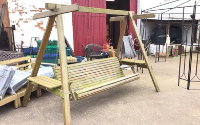 A swinging garden seat with six foot hanging slatted bench...