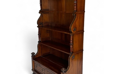 A tall William IV mahogany and ebonised four-tier waterfall ...