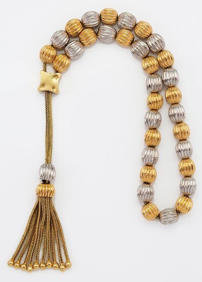 A two colour row of Komboloi beads, composed of a series of yellow and white reeded beads with tassel front, stamped 750, length 30.0cm, approximate gross weight 37g