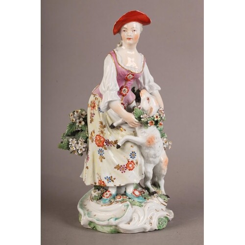 AN 18TH CENTURY PORCELAIN FIGURE OF A SHEPHERDESS AND SHEEP ...