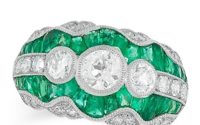 AN EMERALD AND DIAMOND DRESS RING set with three