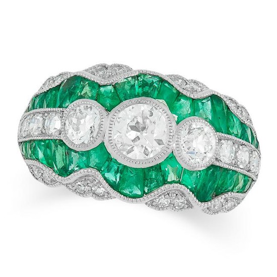 AN EMERALD AND DIAMOND DRESS RING set with three
