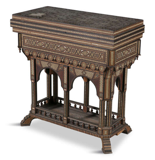 AN MIDDLE EASTERN INLAID OLIVEWOOD GAMES TABLE, profusely...