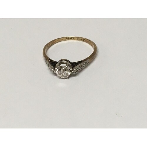 An 18carat gold and platinum ring set with a solitaire diamo...