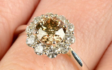 An 18ct gold 'brown' diamond and diamond cluster ring.