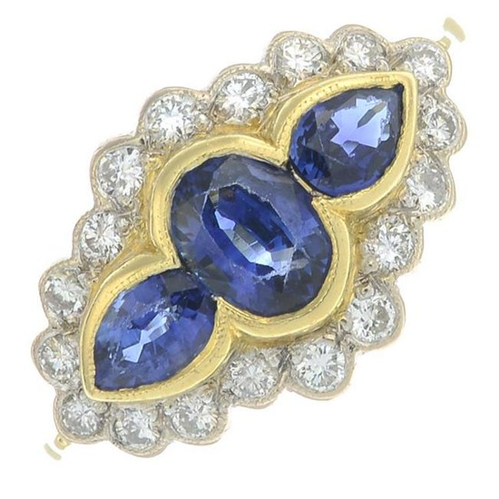 An 18ct gold sapphire three-stone ring, with diamond