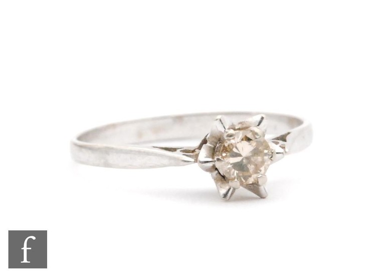 An 18ct white gold diamond solitaire ring, claw set brillian...