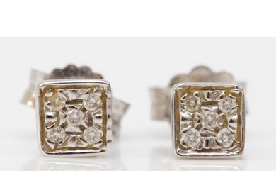 An 18ct white gold pair of brilliant cut diamond ear studs, ...