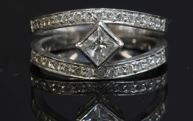 An 18ct white gold single stone princess cut diamond ring