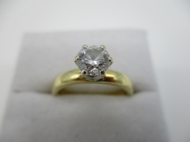 An 18ct yellow gold diamond solitaire ring, raised six claw ...