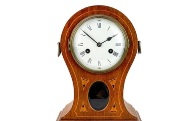 An Edwardian mahogany and inlaid balloon-shaped mantel clock...