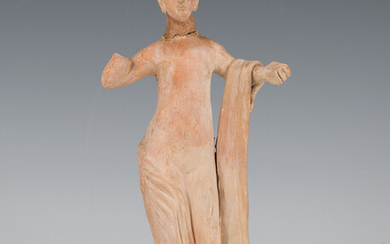 An ancient Greek Hellenistic style terracotta figure of Aphrodite, modelled semi-clad with both arms