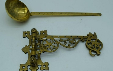An antique brass swivelling wall bracket together with