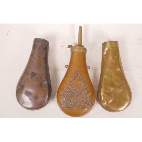 An antique copper and brass powder flask embossed with an Am...
