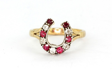 An antique yellow and white metal (tested minimum 9ct gold and silver) horseshoe shaped ring set with old cut diamonds and rubies, (O).