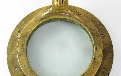 An early 20th century brass porthole and cover, stamped '7NP',...