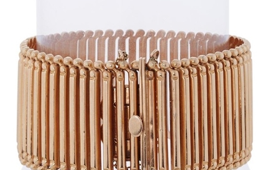 An eighteen karat rose gold bracelet designed as a...