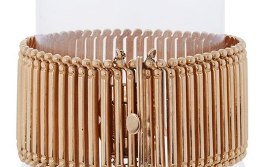 An eighteen karat rose gold bracelet