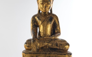 Bouddha, Birmanie, 19e s., bois sculpté, serti de noir et doré, assis en méditation sur...