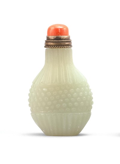 CHINESE CELADON JADE SNUFF BOTTLE In pear shape, with basketweave and fluted body. Height 2.4". Coral stopper.
