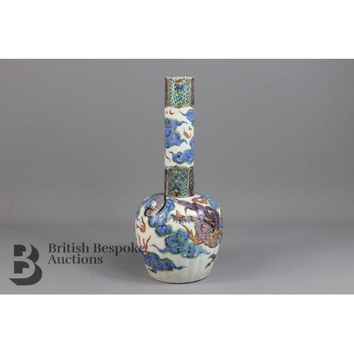 Chinese vase with a long neck, the segmented body painted wi...