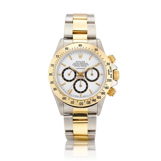 Cosmograph Daytona, Reference 16523 | A yellow gold and stainless steel chronograph wristwatch with suspended logo and bracelet, Circa 1988, Formerly in the Collection of Eric Clapton, CBE | 勞力士 | "Floating" Cosmograph Daytona 型號16523 |...