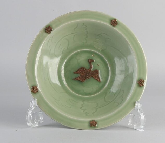 Deep Chinese celadon porcelain dish with bird / rosette