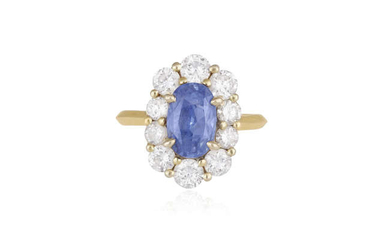 Description A SAPPHIRE AND DIAMOND CLUSTER RING The elongated...