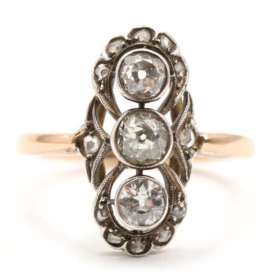 Diamond ring set with three old mine- and numerous rose-cut diamonds, mounted in 14k gold and silver. Size 54. C. 1900–1910.