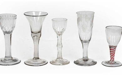 Five Georgian glasses comprising three wine glasses, one having...