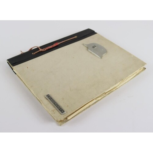 German WW2 photo album with army helmet on the cover contain...